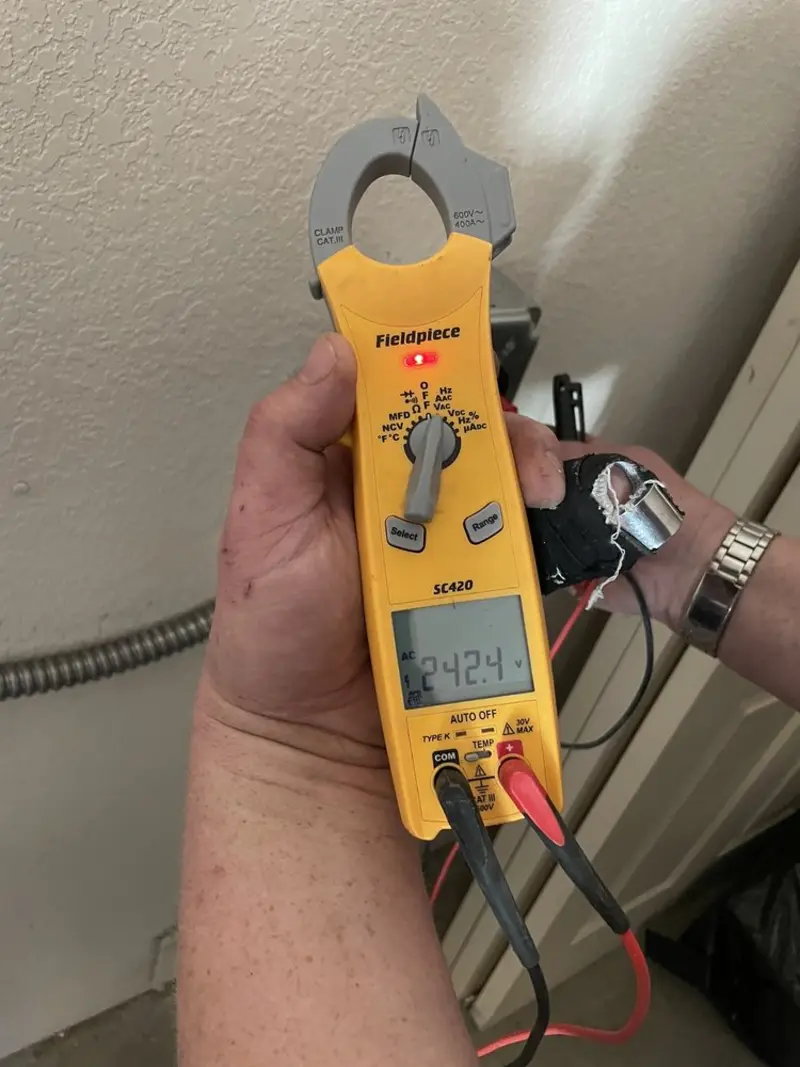 Voltage testing with clamp meter during Ceiling Fan Installation in Edgecliff Village